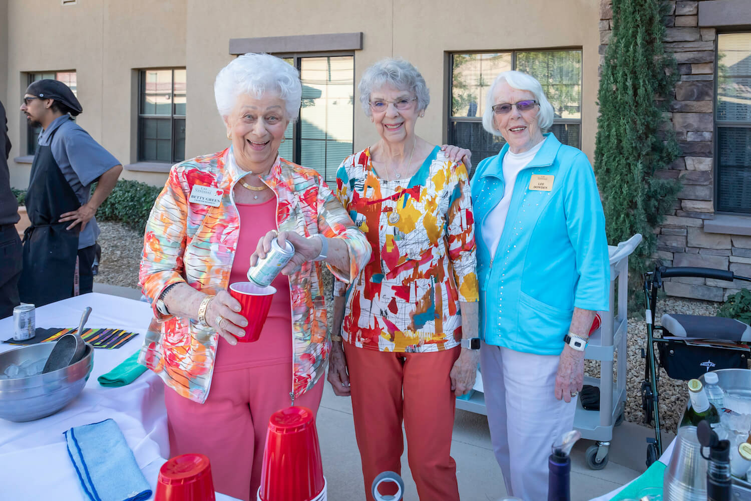 Three ladies smiling for a photo